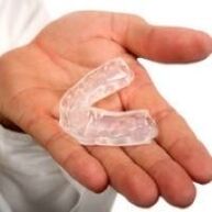 mouth guard for cutting teeth, which is a sign of the presence of parasites